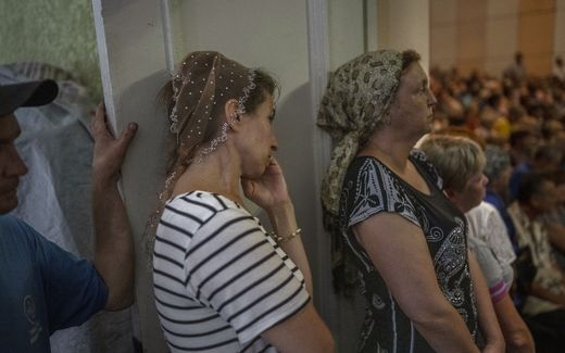 People attend a service in a church in Donbass region. Photo AFP, Bulent Kilic