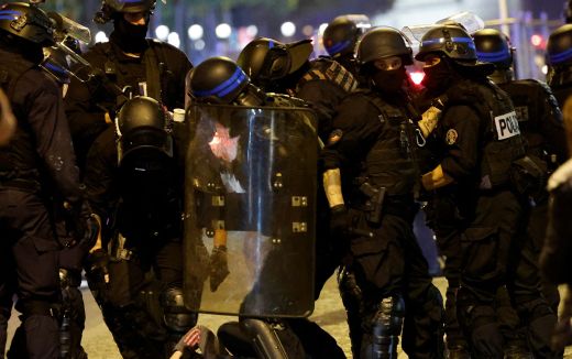 French police officers detain a demonstrator in Paris on July 2, 2023, five days after a 17-year-old man was killed by police in Nanterre, a western suburb of Paris. Photo AFP, Ludovic Marin
