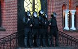 Police block an entrance of a church in Minsk, Belarus. Photo EPA, Tatyana Zenkovich 