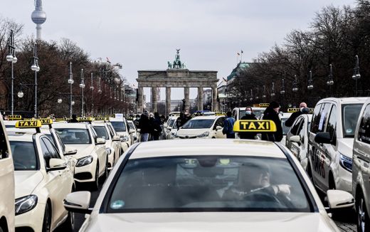 Lines of taxis are parked on 'Strasse des 17. Juni' street near the Brandenburg Gate in Berlin, Germany, 19 February 2021. Photo EPA, Filip Singer