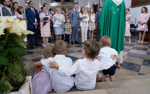 Young children at a christening ceremony. Photo AFP, Janek Skarzynski
