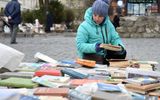 A Ukrainian woman sells second-hand books in the western Ukrainian city of Lviv. Photo AFP, Yuriy Dyachyshyn
