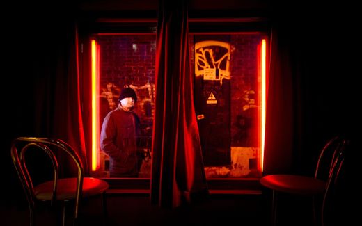 A man looking through the window of a prostitute. Photo ANP, Koen van Weel 

