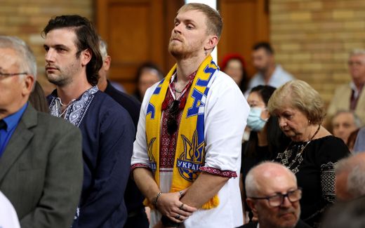 People attend a mass in support for Ukraine. Photo EPA, Brendon Thorne

