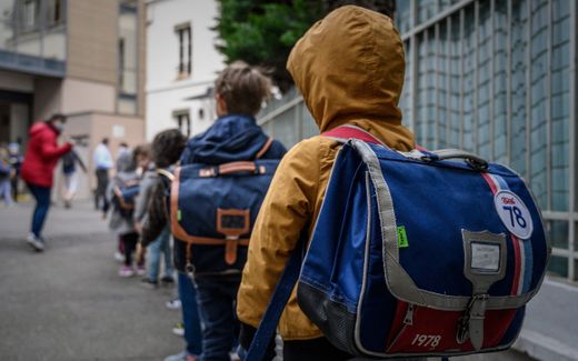 Pupils proceed to their classroom at the private Catholic school Institut Sainte-Genevieve in Paris. Photo AFP, Philippe Lopez