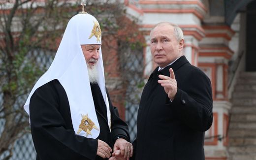 Russia's President Vladimir Putin and Russian Orthodox Patriarch Kirill (L) talking during a wreath-laying ceremony at the Monument to Minin and Pozharsky on Red Square on the National Unity Day in Moscow. Photo AFP, Gavriil Grigorov