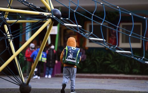 Children wait at the schoolyard before entering the building to attend school lessons at the Petri primary school in Dortmund, western Germany. Photo AFP, Ina Fassbender
