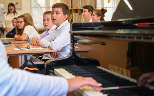 Singing in a Christian school. Photo AFP, Attila Kisbenedek
