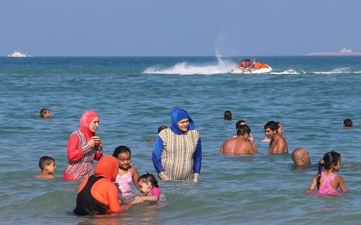 Women wearing burkinis at the beach. Photo EPA, Mohamed Messara 