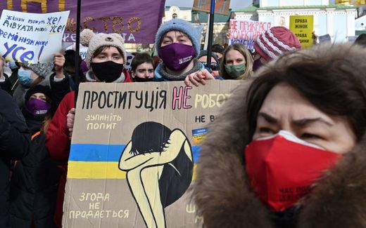 Activists hold placards and chant slogans as they take part in a march for the International Women's Day in Ukrainian capital of Kiev. Photo AFP, Sergei Supinksky