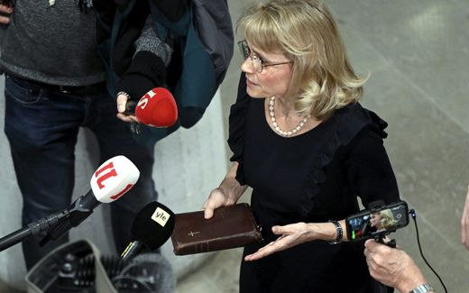 Räsänen holding a Bible when speaking to the press, prior to one of her court sessions. Photo AFP, Antti Aimo-Koivisto

