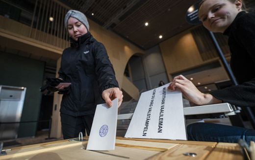 A voter casts her ballot at a polling center during the general elections in Finland in Helsinki. Photo AFP, Jonathan Nackstrand
