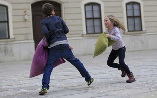 Children enjoy a mass pillow fight event in Vienna. Photo AFP, Alexander Klein