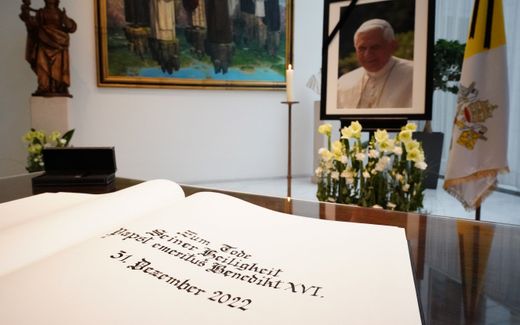 A portrait of late Pope Emeritus Benedict XVI with a black mourning ribbon is on display along with a book of condolence on the occasion of the former Pope's death, at the Apostolic Nunciature in Berlin, Germany, 02 January 2023. Former Pope Benedict XVI died on 31 December at his Vatican residence, aged 95. Photo EPA, Clemens Bilan Australia and New Zealand