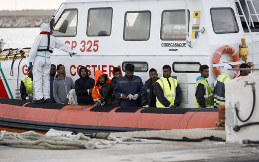 Migrants who survived a shipwreck off the Libyan coast, wait to disembark in the port of Pozzallo, Sicily Island, southern Italy, 13 March 2023. Photo EPA, Francesca Ruta