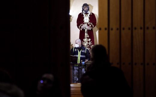 A member of the Spanish National Police stands inside San Isidro church in Algeciras. A man was arrested after stabbing a church assistant to death and injuring four more people at the church, among which was a priest. Photo EPA, A. Carrasco Ragel