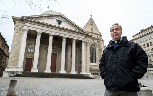 Father Pascal Desthieux, who celebrated the first Catholic Mass in 500 years, poses in front of the St Pierre's cathedral, a bastion of Swiss Reformation, on February 19, 2020. Photo AFP, Fabrice Coffrini