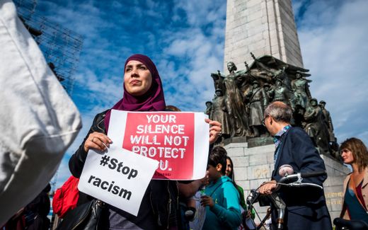 People hold posters as they protest against 'hate and islamophobia' in Brussels. Photo AFP, Hatim Kaghat