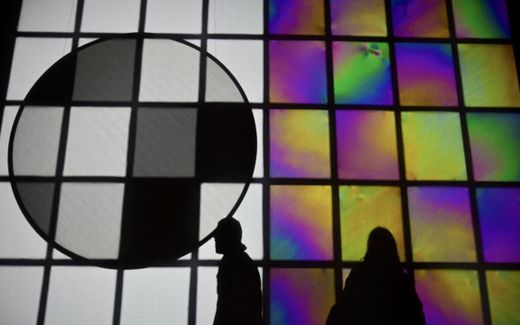 The silhouettes of two visitors are seen in front of an art piece by Danish-Icelandic artist Olafur Eliasson in Berlin, Germany. Photo AFP, Lilith von Borstel