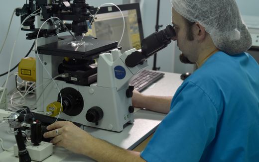 A picture taken in Kiev on March 31, 2017, shows embryologist Viktor Nagornyi working in a laboratory of the Kiev-based Nadiya private fertility clinic. Photo AFP, Genya Savilov