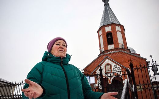 Nadezhda Dolya, 65, retired saleswoman, gestures in front of a church in the Russian village of Maslova Pristan outside Belgorod, a few kilometres from the Ukrainian border. Photo AFP, Alexander Nemenov