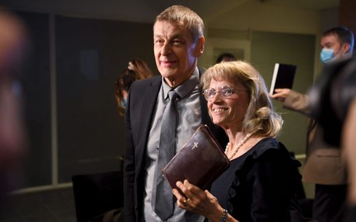 Paivi Räsänen (r.) with a bible in her hand and her husband Niilo Räsänen at the arrival  at the Helsinki District Court to attend a court session on 24 January 2022. Photo AFP, Antti Aimo-Koivisto
