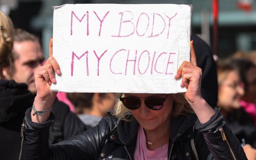 A counter-protestor, against a 'March for Life' demonstration, holds a placard reading 'My Body My Choice' near the event in Berlin. Photo EPA, Felipe Trueba