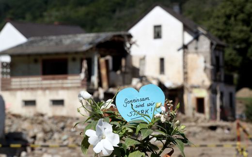 A heart with the inscription 'Together we are strong' inside a flower is seen in the district of Ahrweiler, Germany, 3 September 2021. Large parts of Western Germany were hit by heavy, continuous rain in the night to 15 July resulting in local flash floods that destroyed buildings and swept away cars. Photo EPA, Friedemann Vogel