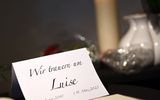 A book of condolences for the killed girl Luise and a card reading "We mourn Luise" are on display in the Protestant church in Freudenberg. Photo AFP, Ina Fassbender