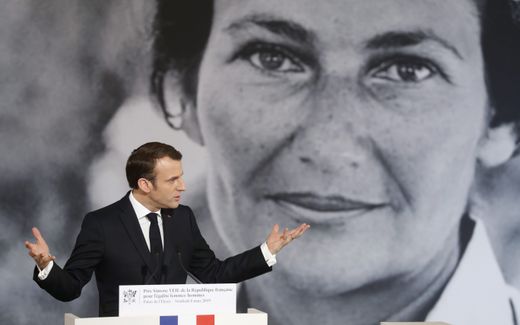 Macron during an award ceremony of the Simone Veil prize. In the background, a photo of Veil, who legalised abortion in 1975. Photo EPA, Thibaut Camus