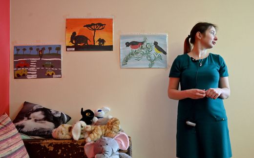 In this photograph taken on June 4, 2020, Olga Korsunova, a 27-year-old going through her fourth surrogate pregnancy, poses in her rental flat in Kiev. Photo AFP, Sergei Supinsky