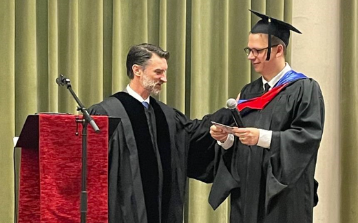 Sashko receives his degree from the Evangelical Reformed Seminary of Ukraine. Photo ERSU