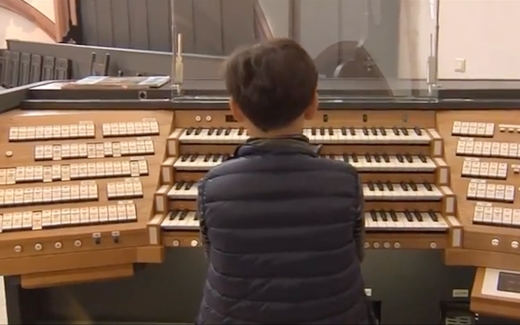 Young boy in the City Church of Bayreuth, Germany. Still from YouTube video Sontagsblatt