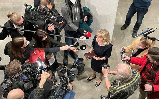 Mrs Rasanen surrounded by media in courtroom January 2022. Photo Twitter